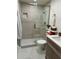 Updated bathroom featuring a tiled walk-in shower and stylish vanity at 9987 85Th Way, Seminole, FL 33777