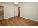 Bedroom with wood-look flooring and access to the en-suite bathroom at 9987 85Th Way, Seminole, FL 33777