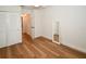 Bedroom with wood-look flooring and access to the en-suite bathroom at 9987 85Th Way, Seminole, FL 33777