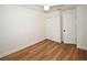 Bedroom with wood-look flooring and double closet at 9987 85Th Way, Seminole, FL 33777
