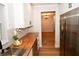 Bright kitchen with butcher block counters, stainless fridge and view of dining room at 9987 85Th Way, Seminole, FL 33777