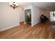 Spacious open-plan living area with bright interiors, hardwood floors, neutral walls, and recessed lighting at 9987 85Th Way, Seminole, FL 33777