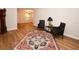 Inviting room with classic furnishings, neutral walls, hardwood floors, and bright natural light at 9987 85Th Way, Seminole, FL 33777