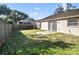 Backyard view with privacy fence, patio, and lawn at 1009 Hardwood Dr, Valrico, FL 33596