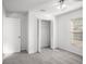 Bedroom with new neutral carpet, blinds, closet, and white walls at 1009 Hardwood Dr, Valrico, FL 33596