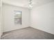 This bedroom has a ceiling fan and a window for natural light at 1009 Hardwood Dr, Valrico, FL 33596