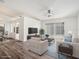 Inviting living room with wood floors, large window, and neutral decor, perfect for relaxing and entertaining at 1009 Hardwood Dr, Valrico, FL 33596