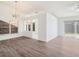 Bright living room featuring hardwood floors and sliding glass doors to the backyard at 1009 Hardwood Dr, Valrico, FL 33596