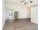 Open-concept living room with hardwood floors and large windows at 1009 Hardwood Dr, Valrico, FL 33596