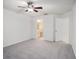 The main bedroom features an ensuite bathroom and neutral colored carpet and walls at 1009 Hardwood Dr, Valrico, FL 33596