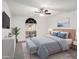 Serene bedroom featuring large window, ceiling fan, and soft carpet at 1009 Hardwood Dr, Valrico, FL 33596