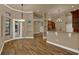 Open dining area features decorative lighting and views of the kitchen at 12139 Buckingham Way, Spring Hill, FL 34609