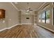 Spacious living room featuring custom shelving and lots of natural light at 12139 Buckingham Way, Spring Hill, FL 34609