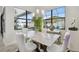 Dining area features a marble table with seating for six and modern pendant lighting at 12716 Flatwood Creek Dr, Gibsonton, FL 33534