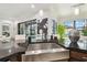 Close-up of kitchen island with stainless steel sink, black countertops, and decorative accents at 12716 Flatwood Creek Dr, Gibsonton, FL 33534