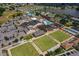 Overhead view of the community recreation center, showcasing the pool, lawn bowling, and amenities at 1509 Blackstone Cir, Sun City Center, FL 33573