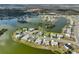 Stunning aerial view of waterfront homes nestled around a lake community with lush greenery at 1509 Blackstone Cir, Sun City Center, FL 33573