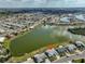 Aerial view of the community, showcasing lakefront property and neighborhood layout at 1509 Blackstone Cir, Sun City Center, FL 33573