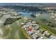 Scenic aerial showcasing community, waterfront properties, and lush natural surroundings at 1509 Blackstone Cir, Sun City Center, FL 33573