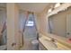 Bathroom featuring vanity with marble countertop and colorful curtains at 1509 Blackstone Cir, Sun City Center, FL 33573