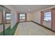 Bedroom featuring a ceiling fan, windows, and mirrored closet doors at 1509 Blackstone Cir, Sun City Center, FL 33573