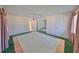 Bedroom with ceiling fan, large closet and windows with curtains at 1509 Blackstone Cir, Sun City Center, FL 33573