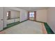 Bedroom with neutral walls, ceiling fan, and window with pink curtains at 1509 Blackstone Cir, Sun City Center, FL 33573