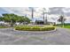 Well-maintained entrance to Sun City Center Veterans Memorial Community Hall with manicured landscaping at 1509 Blackstone Cir, Sun City Center, FL 33573