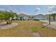 Charming one-story home with a well-manicured lawn, beautiful landscaping, and a spacious two-car garage at 1509 Blackstone Cir, Sun City Center, FL 33573