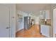 Modern kitchen featuring stainless steel appliances, granite countertops, and white cabinetry at 1509 Blackstone Cir, Sun City Center, FL 33573