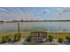 A serene lake view featuring a bench, perfect for enjoying peaceful moments in a tranquil outdoor setting at 1509 Blackstone Cir, Sun City Center, FL 33573