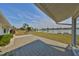 Paver patio offers serene lake views, perfect for relaxing or entertaining guests outdoors at 1509 Blackstone Cir, Sun City Center, FL 33573