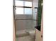 Walk-in shower with patterned tiling, framed glass door, and modern fixtures at 1522 Gulf Blvd, Indian Rocks Beach, FL 33785