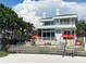 Modern beachfront home with an outdoor lounge area at 1522 Gulf Blvd, Indian Rocks Beach, FL 33785