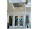 Modern front door with artistic stained glass at 1522 Gulf Blvd, Indian Rocks Beach, FL 33785