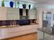 Well-appointed kitchen with stainless steel appliances, custom cabinets, and ample counter space at 1522 Gulf Blvd, Indian Rocks Beach, FL 33785