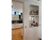 Open wall niche looking into the kitchen and displays decorations at 1522 Gulf Blvd, Indian Rocks Beach, FL 33785