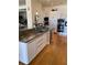 Island kitchen with stainless steel appliances, custom cabinets, and modern design elements at 1522 Gulf Blvd, Indian Rocks Beach, FL 33785