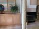Detail of fireplace, column, and custom built-in cabinets in main bedroom at 1522 Gulf Blvd, Indian Rocks Beach, FL 33785