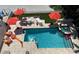 Aerial view of backyard with private pool, spa, and multiple seating areas at 1522 Gulf Blvd, Indian Rocks Beach, FL 33785