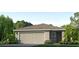 Charming single-story home with a two-car garage, manicured lawn, and lush landscaping at 17259 Whiskey Creek Trl, Parrish, FL 34219