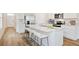 Bright kitchen with stainless steel appliances, a marble island, and a breakfast bar at 17259 Whiskey Creek Trl, Parrish, FL 34219