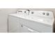 This is a front-loading white washer and dryer at 17259 Whiskey Creek Trl, Parrish, FL 34219
