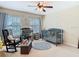 Charming Bedroom with a crib, rocking chair, and soft, natural lighting at 1805 Abbey Trace Dr, Dover, FL 33527