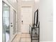 Bright foyer with a front door, mirror, and console table at 1805 Abbey Trace Dr, Dover, FL 33527