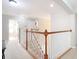 Upper hallway featuring carpet and a white wood railing at 1805 Abbey Trace Dr, Dover, FL 33527