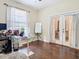 Cozy office with hardwood floors, French doors, and large window at 1805 Abbey Trace Dr, Dover, FL 33527