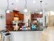 Kitchen area with a granite island, pendant lighting, and modern stainless-steel appliances at 1805 Abbey Trace Dr, Dover, FL 33527