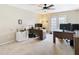 Bright home office with natural light, neutral tones, and two desks at 1805 Abbey Trace Dr, Dover, FL 33527