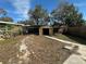Backyard features a partial view of a storage shed and fencing at 1817 Meridel Ave, Tampa, FL 33612